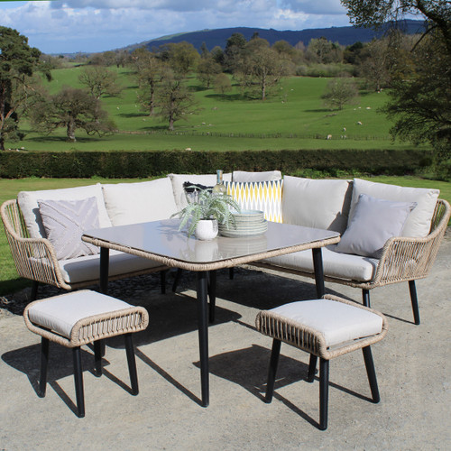 A view of a 7 seater corner dining garden furniture set on a patio