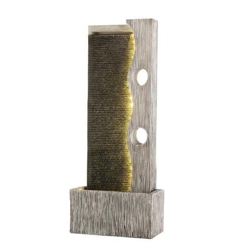 A tall, modern tabletop water fountain with a textured grey surface, featuring a curved golden flow and two circular cutouts, creating a soothing ambiance.