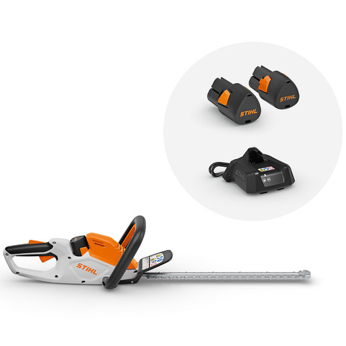 STIHL cordless hedge trimmer with long cutting blade, two batteries and charger.