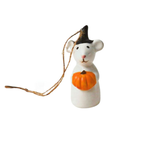 A small white mouse holding an orange pumpkin while wearing a black witches hat. String is threaded through the top of the hat.