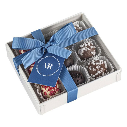 Box of chocolates with blue ribbon and tag.