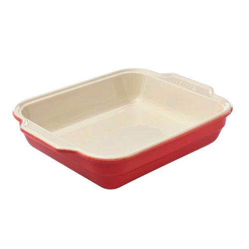 Red ceramic baking dish on a white background.