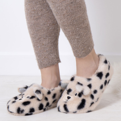 Someone wearing slippers designed to look like Dalmatians with 3D ears. Someone wearing slippers designed to look like Dalmatians with 3D ears.