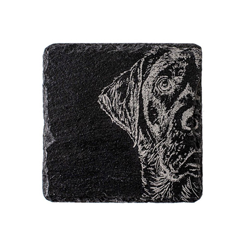 A dark grey, square, slate coaster with a laser engraved designed of a Labrador.