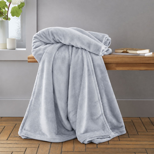 Folded silver grey blanket throw