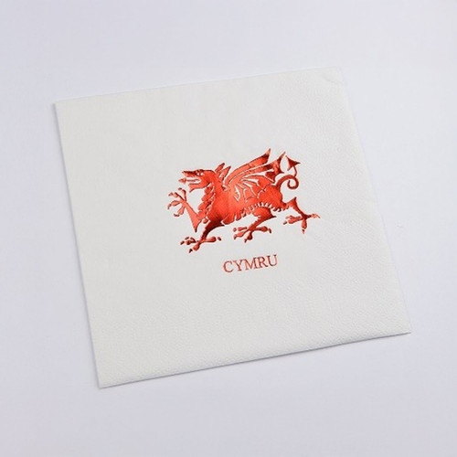 A white napkin with a red Welsh Dragon in the centre.