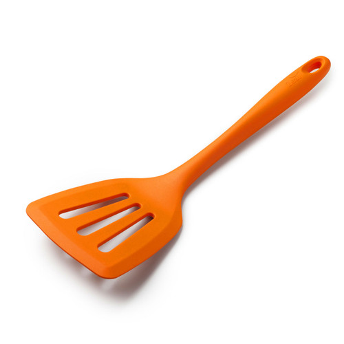 An orange slotted cooking spatula on a white background.