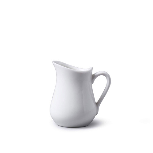 White porcelain milk jug on a plain background.