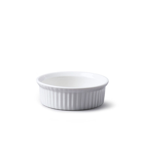 White, round porcelain ramekin on a plain background.