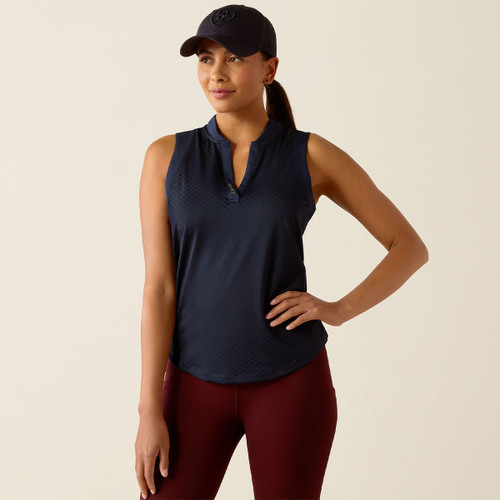 A woman wearing a navy sleeveless baselayer