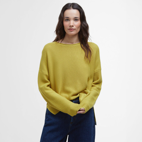 A woman wearing a yellow jumper