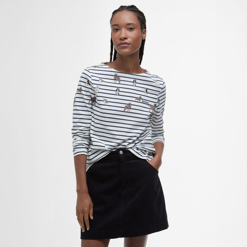 A woman wearing a stripy long sleeve top with a dog print