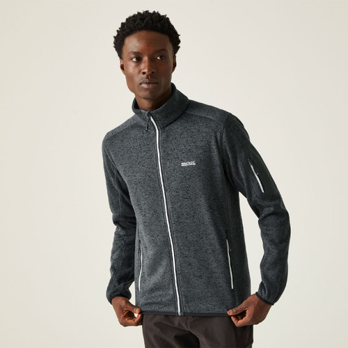 A man wearing a grey full zip fleece with a high collar.