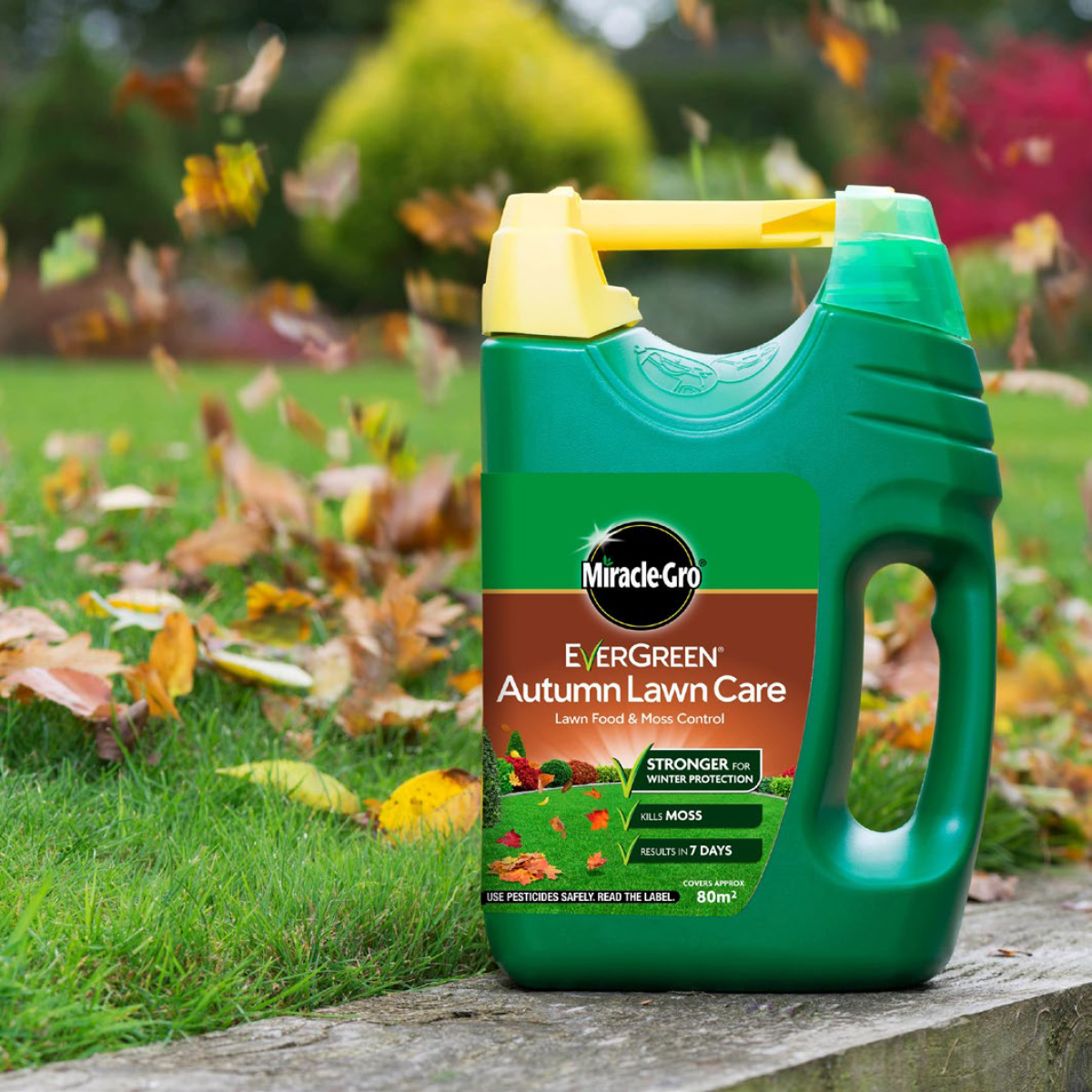 tub of lawn care on a lawn with leaves in the autumn