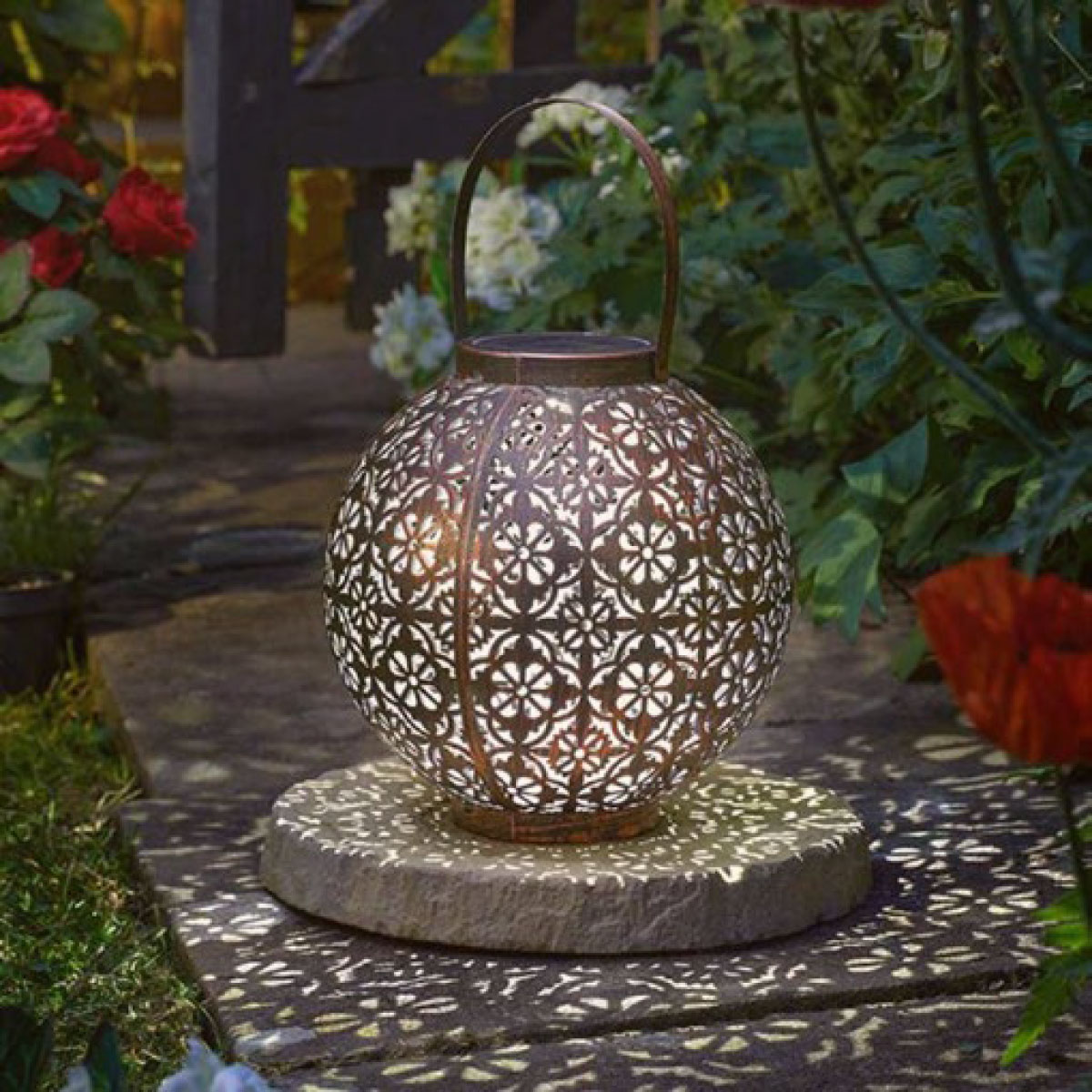 boho garden lantern in the garden in dark