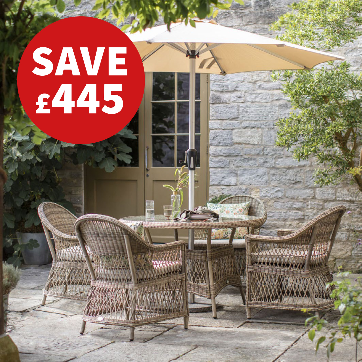 Rattan 4 seater round table garden furniture set with red circle stating "save £445"