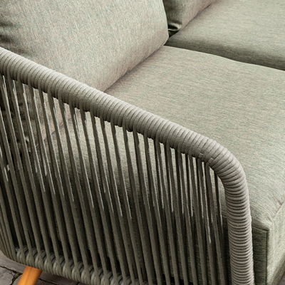 A close up of a dark green rope arm rest on a hartman garden furniture set