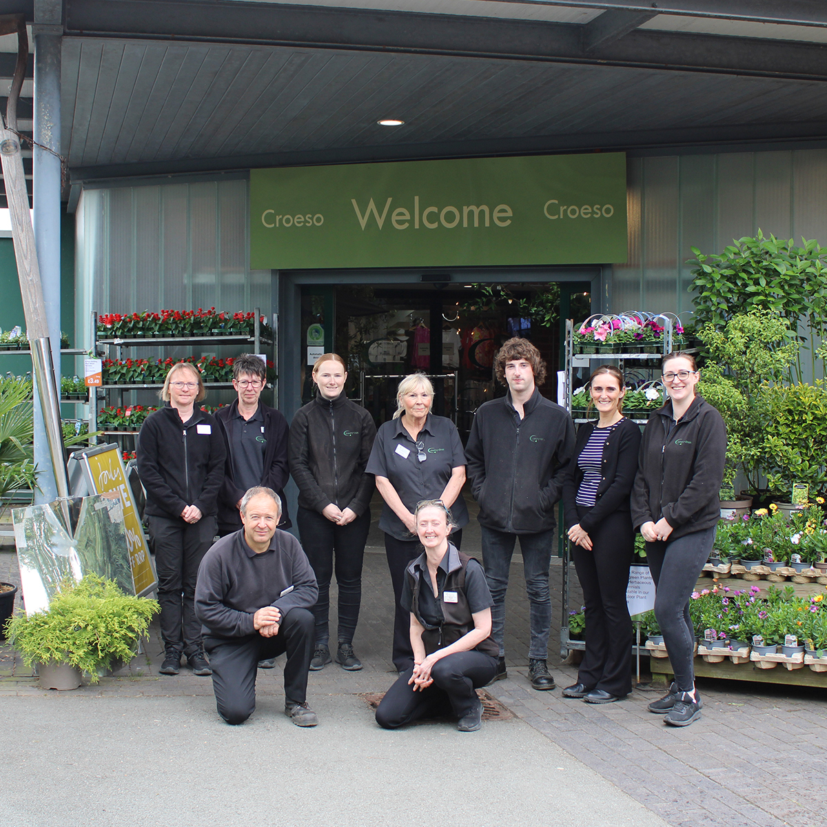 A few members of the Coes-Y-Dinas team outside the entrance