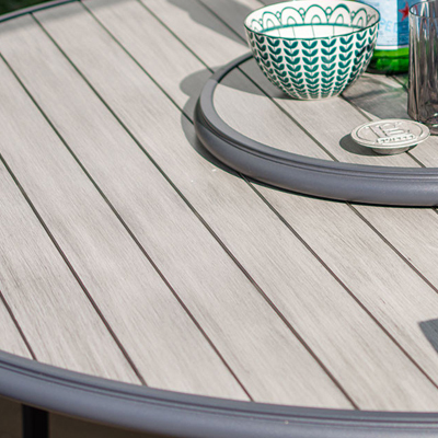 A close up of a wooden table top on a garden furniture table