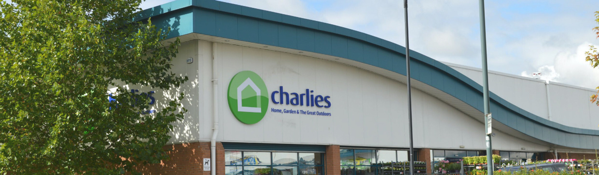A banner containing an image of the front of the Charlies Shrewsbury store.