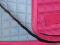 Zoom to view the flannel underside of this hot pink english saddle pad with black piping.  Note:  Flannel color may vary from color shown in pictures.