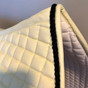 Zoom to view:  Classy Champagne Butter Cream Dressage Saddle Pad with Black Accent Rope/Cord.