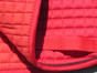 Zoom to view the color and flannel underside of this red pony saddle pad.