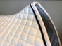 Zoom to View:  White Dressage Saddle Pad with Black Trim/Piping Detail Around the Border.  Classy and Elegant!