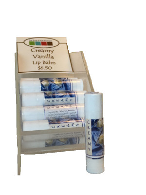 A display of tubes of Creamy Vanilla flavored lip balms.