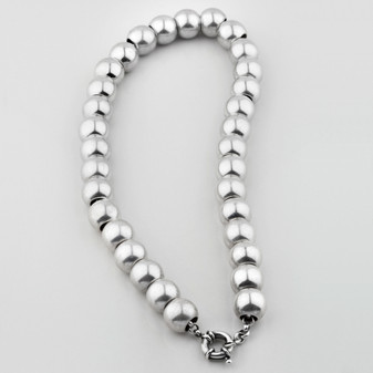 Luminescent silver bead necklace. Finished with a signoretti clasp.