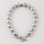 Detailed burnished silver plated bead necklace with T-bar and fob. Length: 46 cm