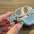 NEW  2505  Four-Flower Zircon Earphone Clip Earphone Accessories 9607