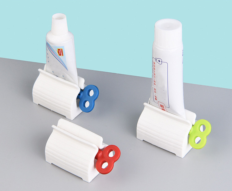 NEW-Rolling Tube Toothpaste Squeezer Toothpaste Seat Holder Stand Rotate Toothpaste Dispenser for Bathroom0013