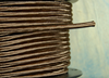 brown round cloth covered 3 wire
