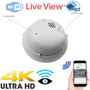CSL Electronics Hard Wired Dual Camera Dummy Smoke Detector Nanny Security Camera DVR with Wireless Streaming Video for iPhone, Tablet and More, image of a white smoke detector with labeled camera spots, WiFi and live view icons, and a smartphone showing remote monitoring.
