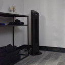 CSC Electronics 4K WiFi Night Vision Security Camera Tower Fan, a black tower fan with night vision security camera functionality in a room setting.