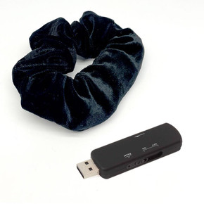 Kjb Security Hair Tie Voice Recorder, a black voice recording device with a USB connector and a black hair scrunchie for discreet audio capture.