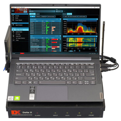Kjb Security Delta X Portable Real-time Spectrum Analyzer 6GHz, showing a laptop running spectrum analysis software with graphical spectrum data and signal monitoring interface.