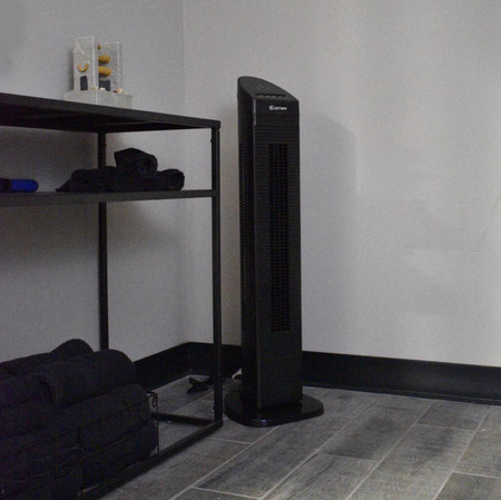 CSC Electronics 4K WiFi Night Vision Security Camera Tower Fan, a black tower fan with night vision security camera functionality in a room setting.