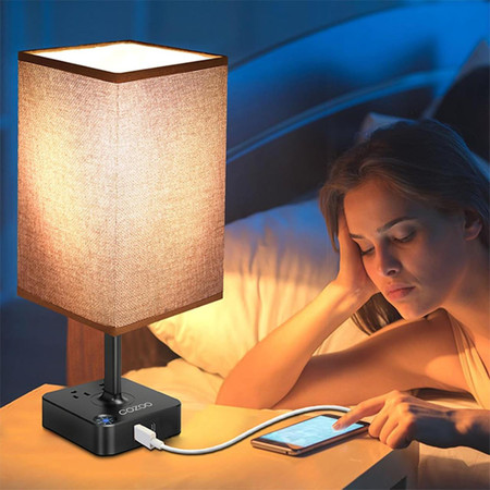 Csc Electronics UHD 4K WiFi Lamp USB Charging Station Bedside Security Camera with Live View WiFi + DVR, showing a modern bedside lamp with built-in security camera, USB charging port, and WiFi connectivity placed on a bedside table.