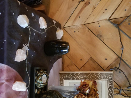 Csc electronics UHD 4k WiFi Essential Mist Air Freshener Security/Surveillance Camera with Live View WiFi + DVR, black compact camera on a table with decoration and wooden wall background.