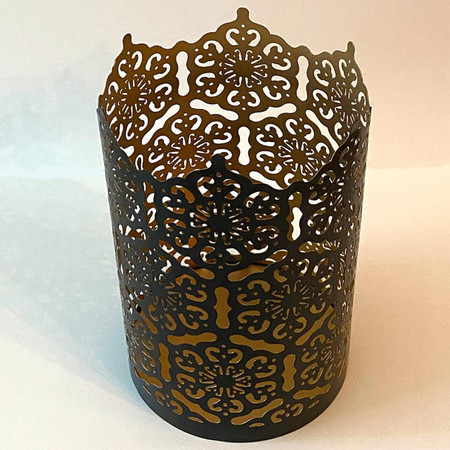 Csc electronics Candle Holder with 4K UHD WiFi Security Camera Inside and 20 Hr Battery, ornate black metal candle holder with intricate cut-out designs for decorative and surveillance purposes.