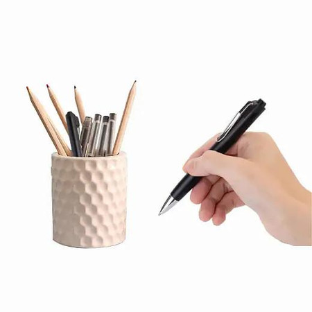 Gio Enterprises Pen Long Standby WiFi Audio Recorder, a hand holding a black pen poised over a white textured pen holder filled with various pens and pencils.