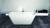 67-in L x 31.5-in W x 24-in H Resin Stone Freestanding Bathtub with center drain, in White