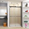 Frameless bypass shower door in matte black frame finish with frosted glass texture and classic Sabrina handles 48-in W x 80-in H
