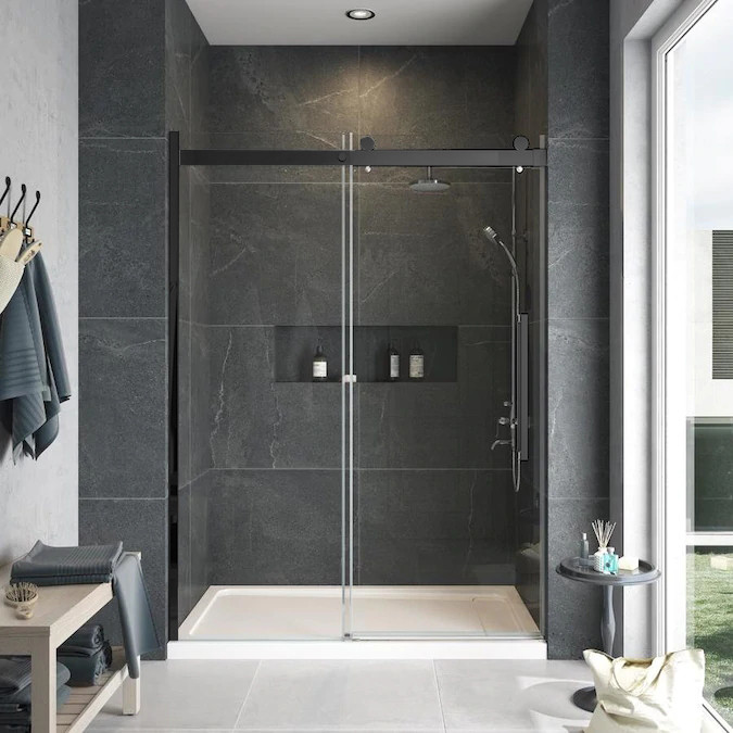 Frameless sliding shower door with fixed panel in matte black with frosted glass texture and Riley handles