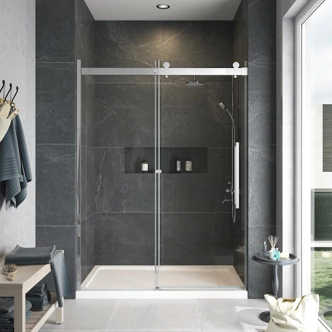 Frameless sliding shower door with fixed panel in polished chrome with clear glass texture and Sabrina handles