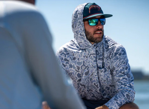 LOCAL BOY OUTFITTERS HEATHER BLEND HOODIE. Variant is Distressed LCF Cobalt. Seen on model.