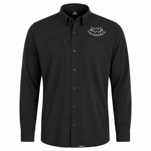 Front view of a Los Cazadores men's long-sleeve performance button-up shirt displayed on an invisible ghost mannequin against a white background. The black technical shirt features a structured button-down collar, full button-front closure, dual vertical zippered chest pockets, and lightweight performance fabric. A white Los Cazadores antler logo is embroidered on the wearer's left chest. The shirt is presented in a high-resolution ecommerce-style product image highlighting its outdoor functionality, clean tailoring, and hunting lifestyle branding.