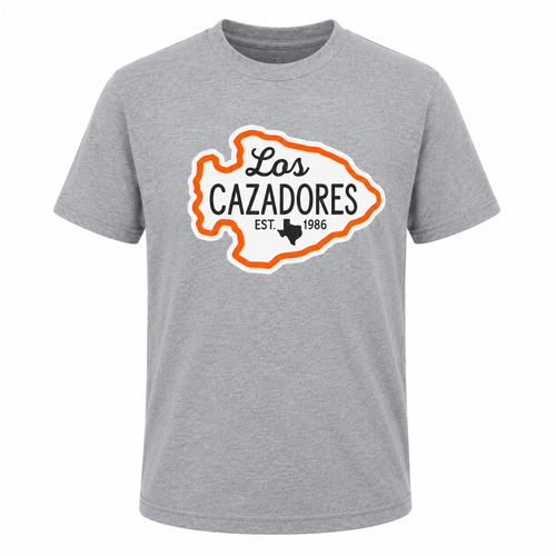Los Cazadores heather gray short-sleeve T-shirt displayed on a ghost mannequin against a white background, featuring a large arrowhead-shaped Los Cazadores logo with orange outline and black text on the chest, including "EST. 1986" and a Texas silhouette.